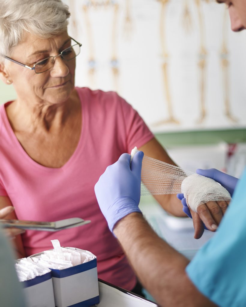 Senior woman with bandage on the hand